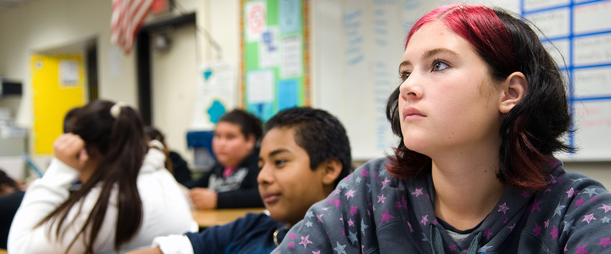 A teacher helping a student 